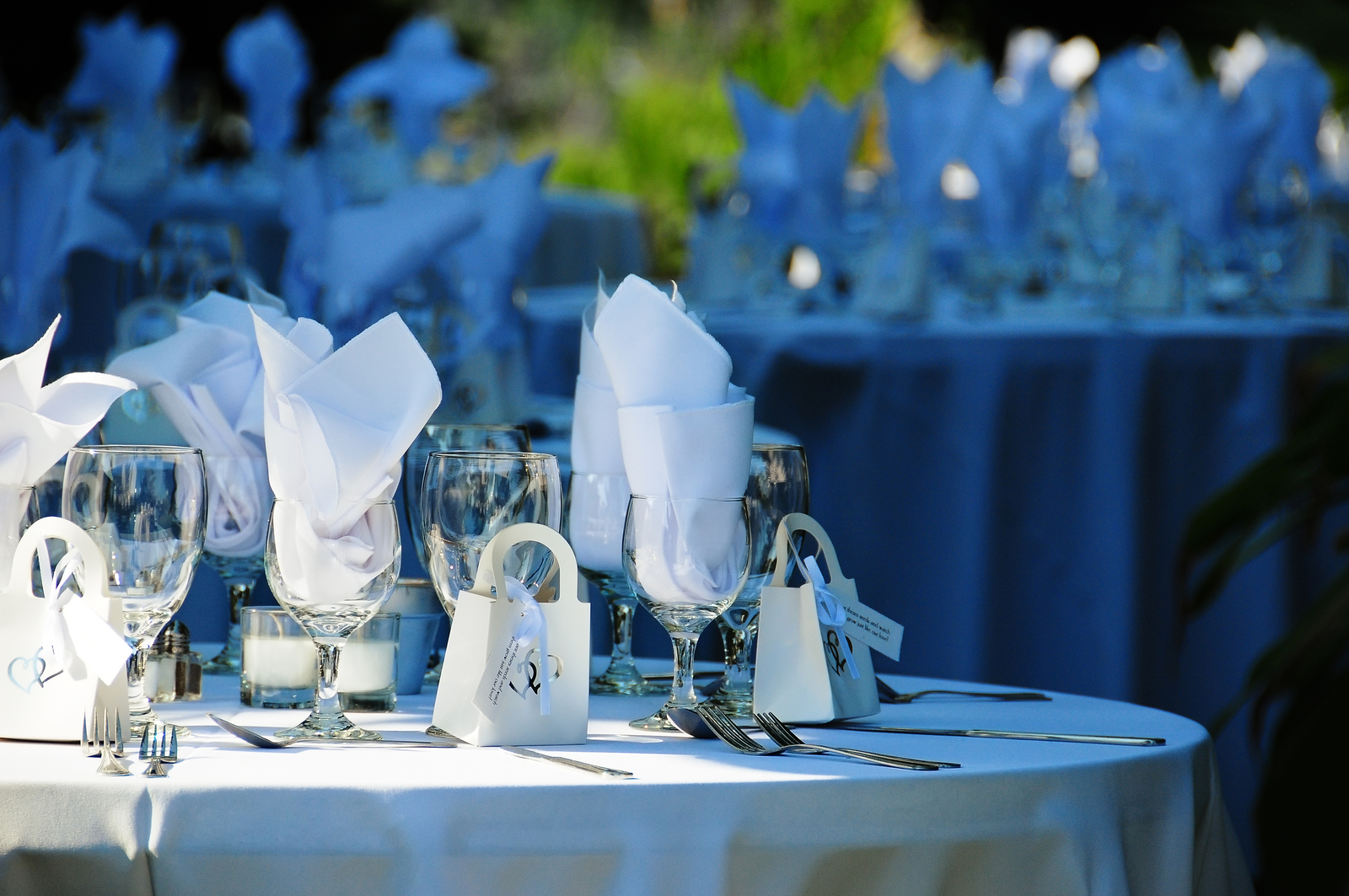 A round table set for a wedding reception in the open air (cropped)
